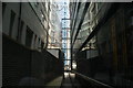 View of Revolution Bar reflected in the side of the Leadenhall Building from Leadenhall Street