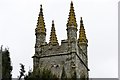 SX3880 : Bradstone: St. Nonna's Church: The tower with its unusual pinnacles by Michael Garlick