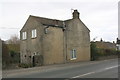 House on north side of A684 in Harmby