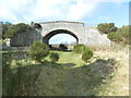 Bridge carrying Kirk Rd, Cromdale, over dismantled railway