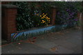 View of a mosaic wall in front of the house opposite The Treatment Rooms on Fairlawn Grove