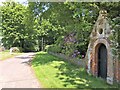 TF6528 : Arched door to the Old Rectory, Wolferton by Richard Humphrey