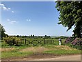 TF6528 : Gate to grassland in Wolferton, Norfolk by Richard Humphrey