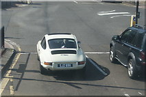 TQ4274 : View of a Porsche 911 waiting at the traffic lights at Eltham station from the top deck of a 132 bus on Well Hall Road by Robert Lamb