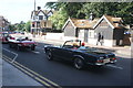 View of a 1967 Mercedes Benz 230SL waiting at the lights at Eltham Church on Well Hall Road