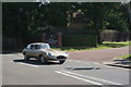 TQ4273 : View of an E-Type Jaguar passing along Court Road by Robert Lamb