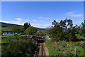 The Far North Line heading west along the Dornoch Firth