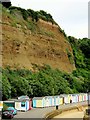 Beach huts under the cliff