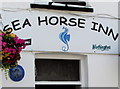 Sea Horse Inn name sign and Dylan Thomas trail marker 6, New Quay