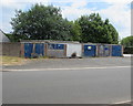 Fenced-off row of lockup garages in Varteg