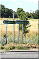 TM4069 : Roadsigns on the A12 Station Road by Geographer