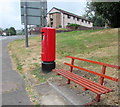 Queen Elizabeth II pillarbox and a brown bench, Merchant Street, Pontlottyn