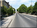 Riding up Dale Road, past St Mary the Virgin church