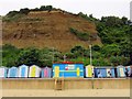 Beach huts under the cliff