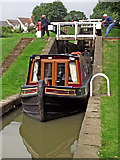 SP5968 : Narrowboat in the Watford staircase Locks, Northamptonshire by Roger  Kidd