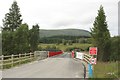 NN5893 : Temporary road crossing the River Spey by Graham Robson