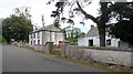 View north past a derelict farmhouse and cottage on the Edenappa Road