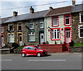 Red car and partly red house in Ogmore Vale