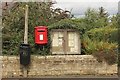 NU2201 : Postbox and noticeboard, Acklington by Graham Robson