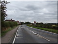 TL9326 : Entering Eight Ash Green on the A1124 Halstead Road by Geographer