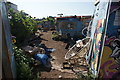 View of old painted sheds in the Nomadic Community Garden