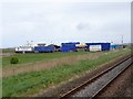 View from a Chester-Holyhead train - The rear of a fun fair, Towyn