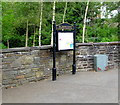 Deri Community noticeboard and a grey Royal Mail drop box, Deri