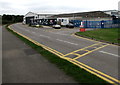 Yellow-marked speed bump near an entrance to  Gloucestershire Airport, Staverton