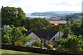 View over Dunster rooftops to the sea