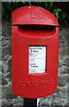 NZ1131 : Close up, Elizabeth II postbox on Saunders Avenue, Hamsterley by JThomas