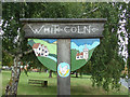 TL8629 : White Colne Village sign by Geographer