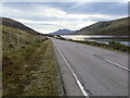 NH1058 : Road (A832) beside Loch a' Chroisg by Peter Wood