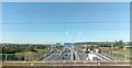 TQ5692 : M25 approaching the A12 junction, from the railway bridge by Christopher Hilton