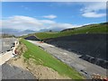 Contoured embankment for the bypass