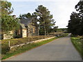 Minor road and deserted former school building in Cabrach