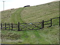 Gated farm track off Manchester Road (A62)