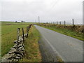 Wall and fence-lined minor road to Cefnhirfynydd