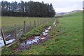 NT0238 : Field drain near Hillridge by Jim Barton