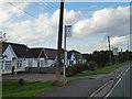 Bus stop outside bungalows in Waddington, by A607