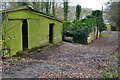 SU4737 : Mossy sheds at West Stoke Farm by David Martin