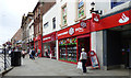 NS3321 : A row of red fronted shops on Ayr High Street by Thomas Nugent