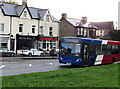 Blue, red and white bus on the A472 Main Road, Maesycwmmer