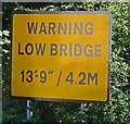 Warning sign for railway bridge 6 WNS on Rugby Road