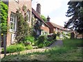 Houses at edge of churchyard