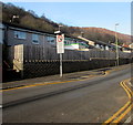 Bungalows behind a wooden fence, Llanbradach