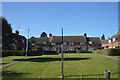 Village sign by open space, Peasmarsh