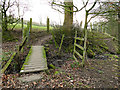 Wooden footbridge alongside Glovershaw Beck