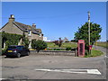 Houses, phone box, post box at Newlands of Geise