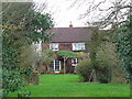 House in Wadborough from the field side