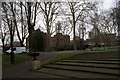 View of St. Pancras Hospital through the trees from St. Pancras Gardens